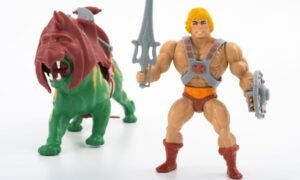 He-Man and another Masters of the Universe figure, Battle Cat. T Mark Taylor, the artist and designer who helped create the figures, has died aged 80