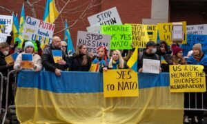 People gather at the Russian mission during a stand with Ukraine rally in New York City