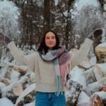 a girls wearing sweater in snow