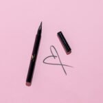 A eyeliner in pink background