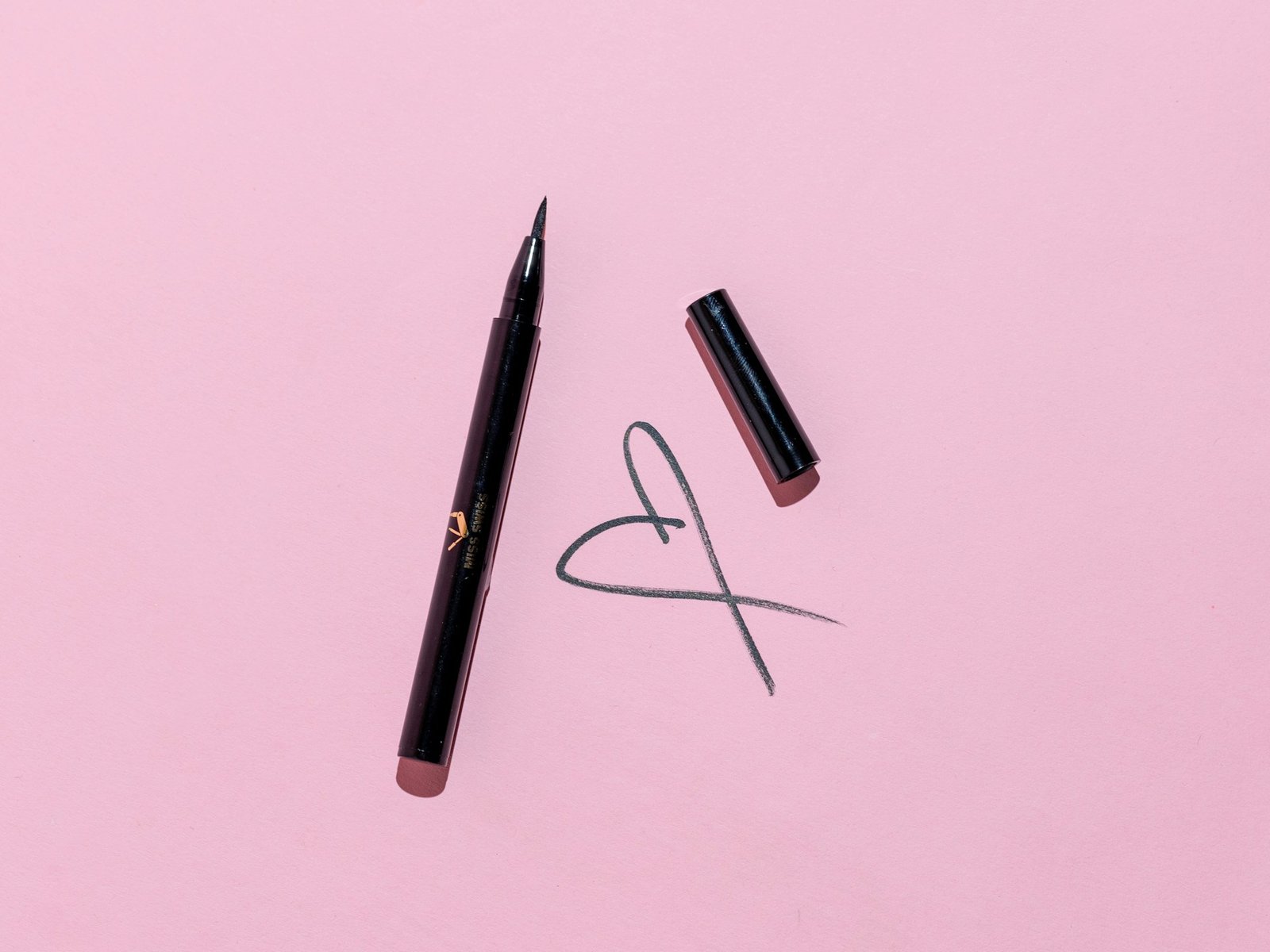A eyeliner in pink background